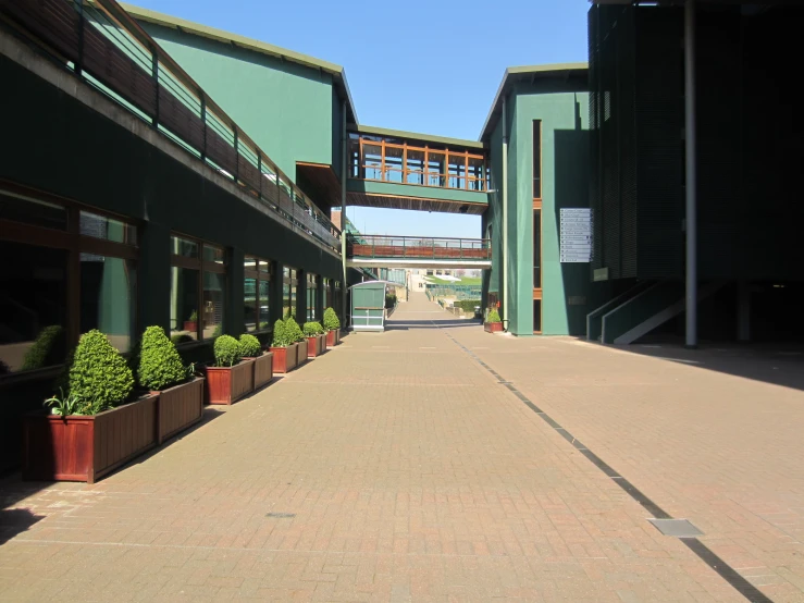 a paved pathway leads to an outdoor courtyard