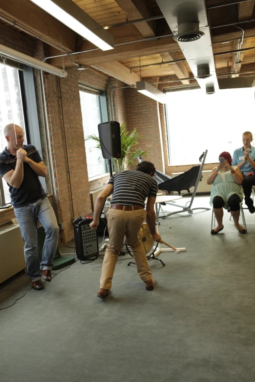 group of men playing wii in a room