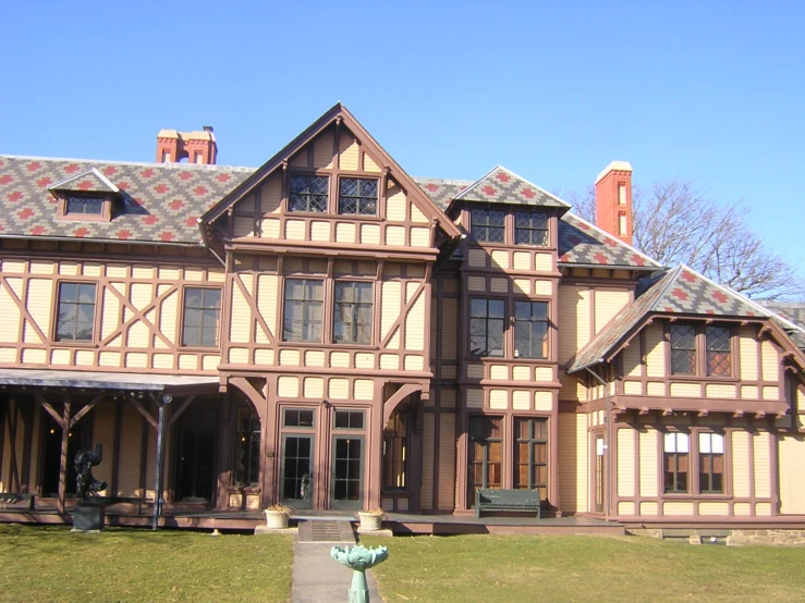 an image of a house with some flowers in front