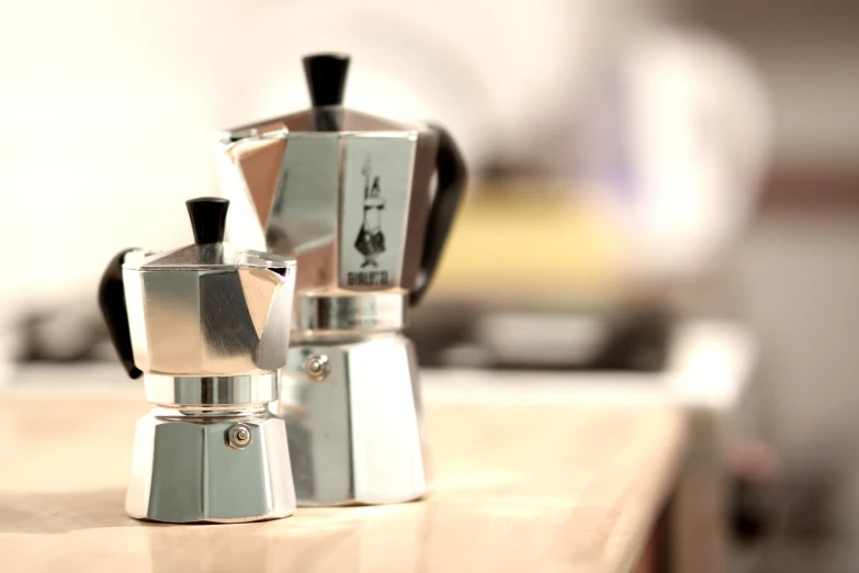 an image of two coffee makers on a counter