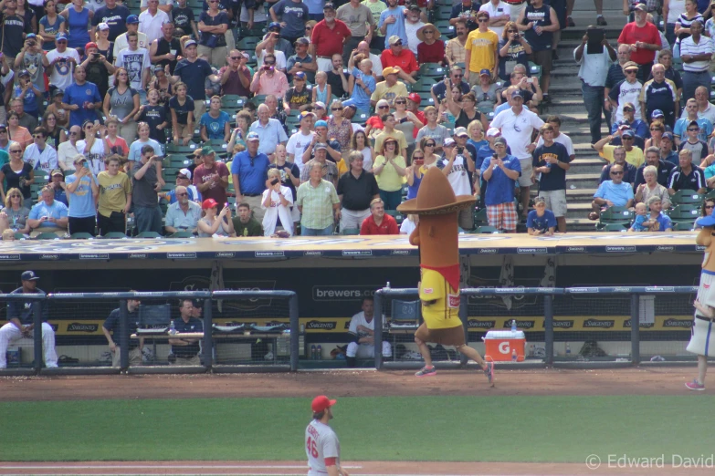 a man wearing an inflatable object in front of a crowd