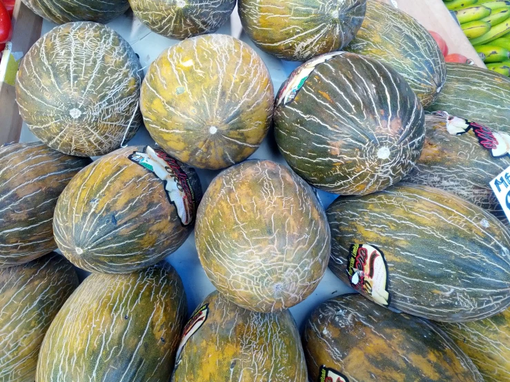 many fruit is piled up together on display