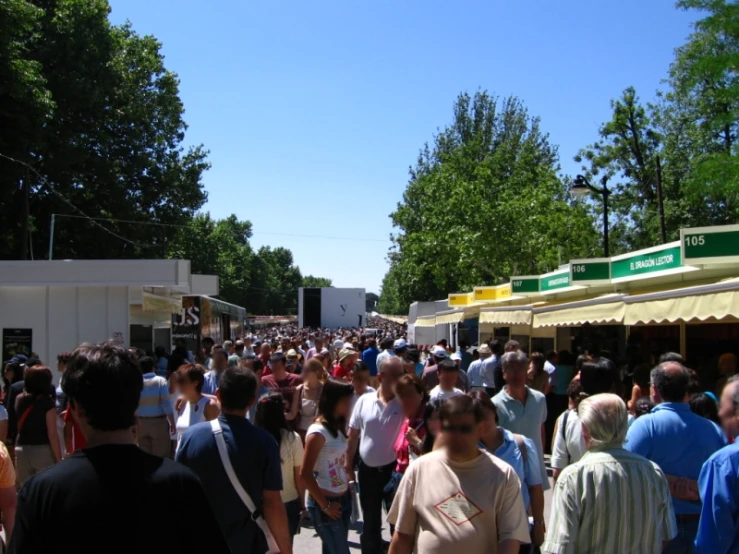 the group of people are enjoying the outdoor food festival