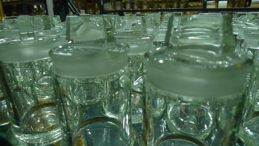 lots of water glasses sitting on top of a table