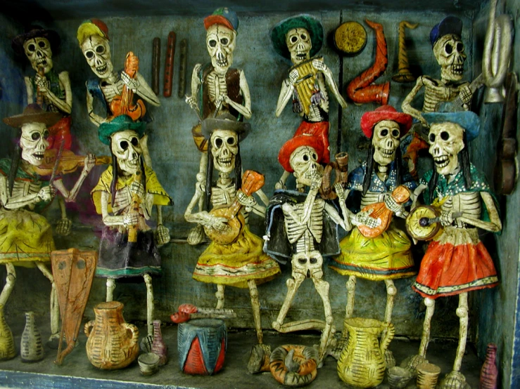 skeletons in colorful costumes, standing near various types of pots and pitchers