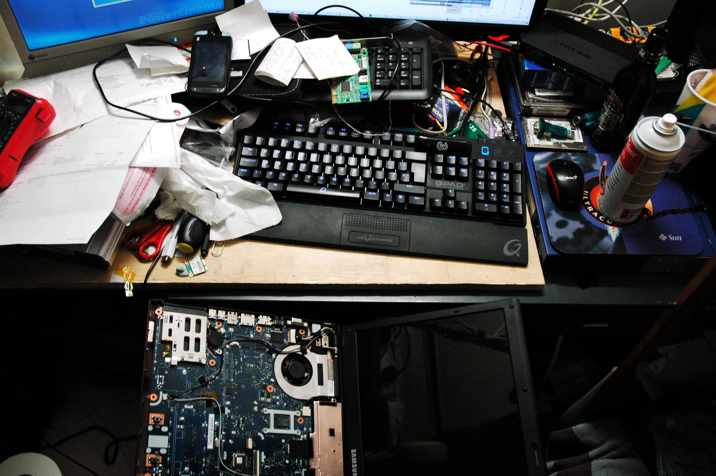 a computer and keyboard are displayed on a desk