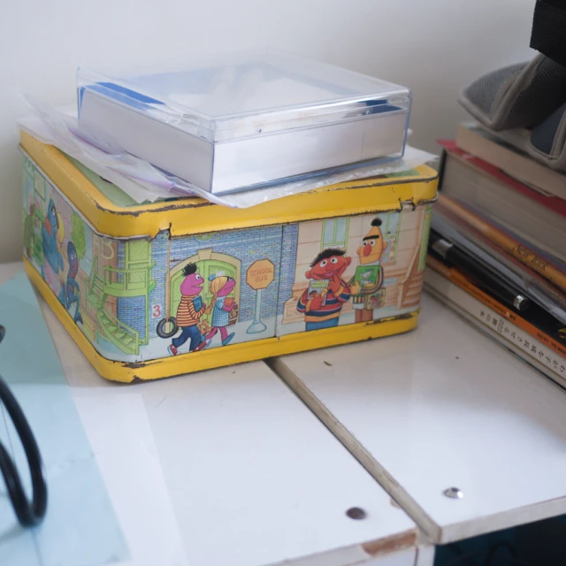 a yellow plastic box is sitting on a desk