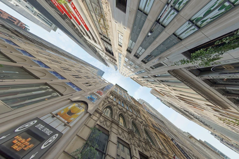 a group of buildings reflecting a sky in different colors