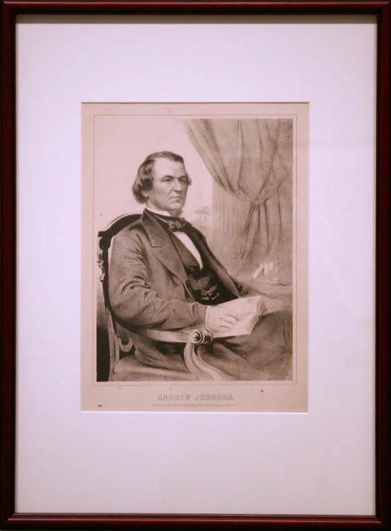 a po of a man in a suit with a tie and a book