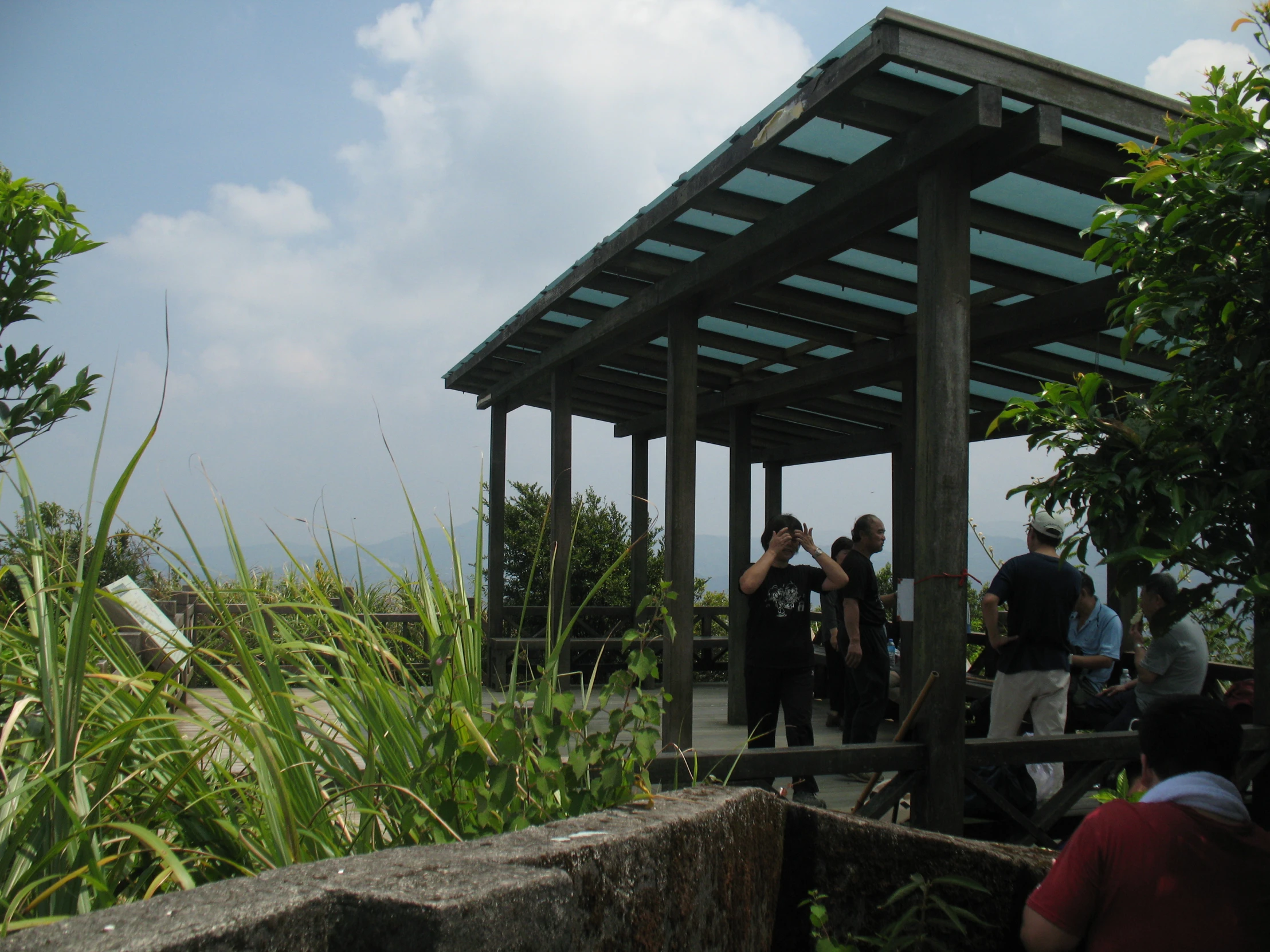 a group of people on a wooden bridge