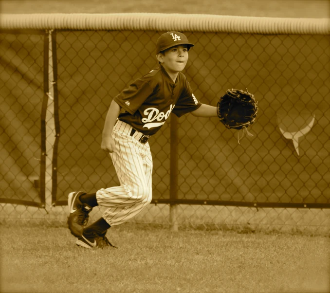 young baseball player in action on field playing baseball