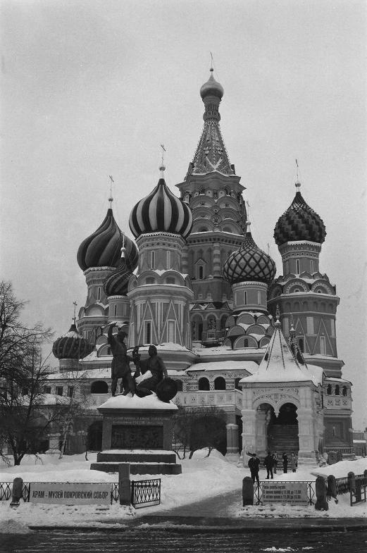 an old po of a church in the snow