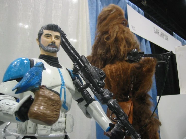 two action figures, one wearing a star wars outfit and the other a chewy