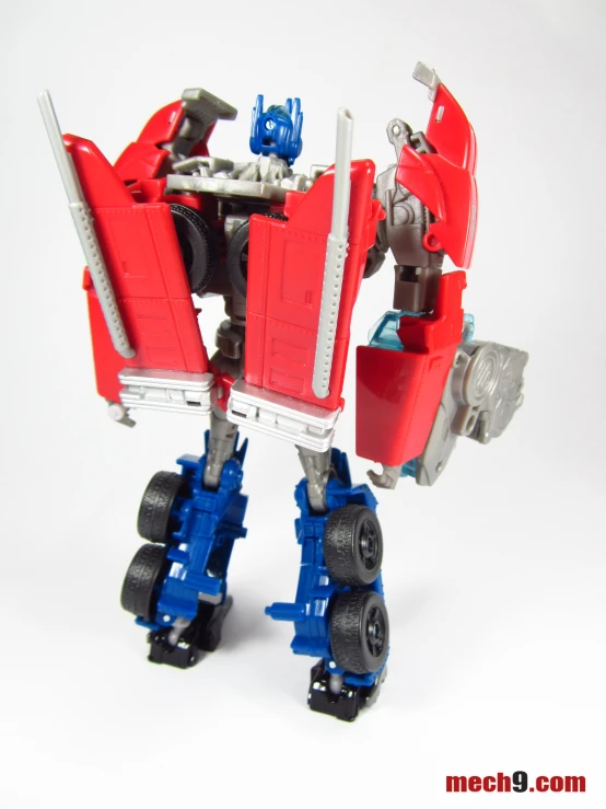 a red and blue toy machine with a car and gear