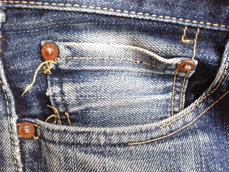 the holes in the jeans are made from a piece of fabric