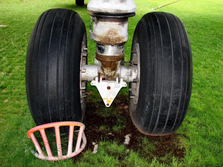 a piece of metal that is in the grass