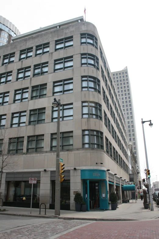 an older building with the corner store to the left