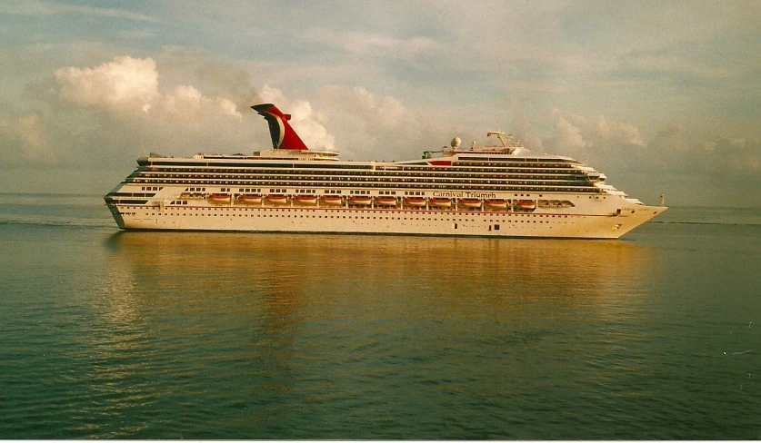 a cruise ship in the open ocean on a sunny day