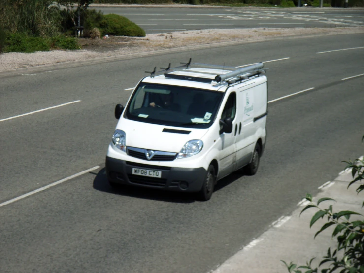 a white van is on the side of the road