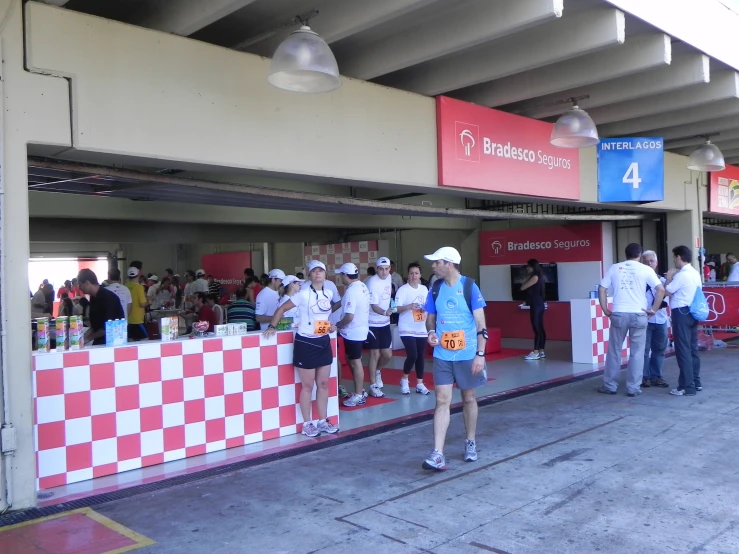 several people on a red and white checkered bar