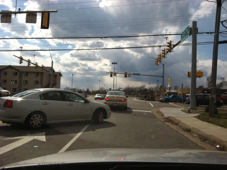 a car at an intersection on a cloudy day