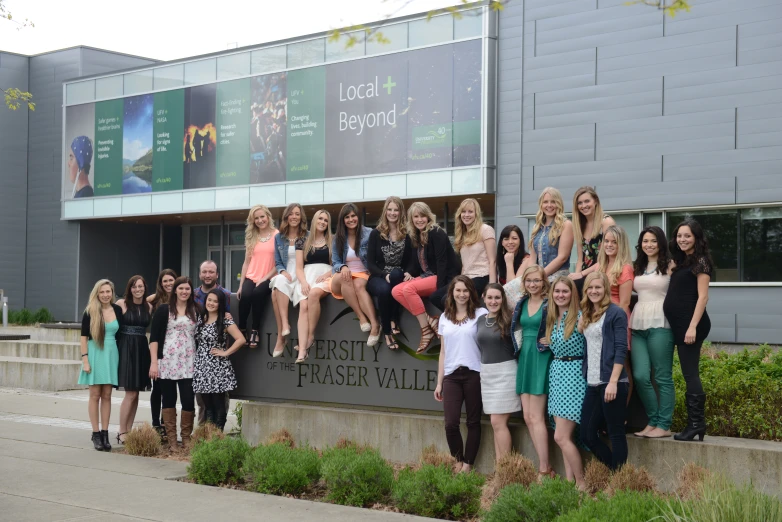 a group of people that are standing in front of a building