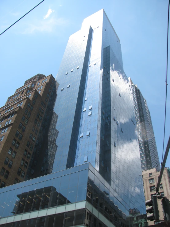 a tall glass building with a sky scr