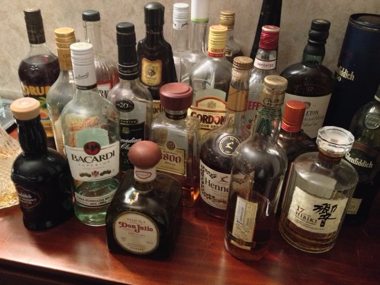 there are several alcohol bottles on a table