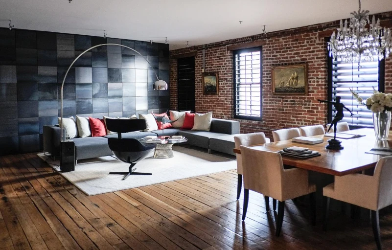 a living room with wood floors and windows