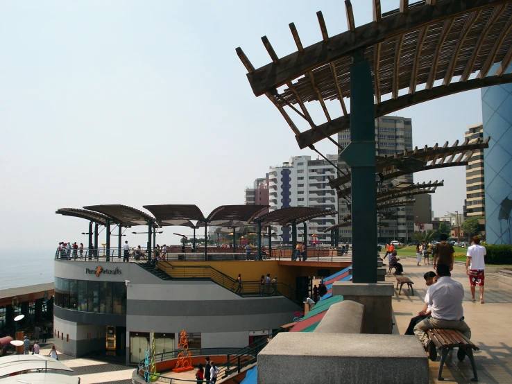 an open pavilion is next to a body of water