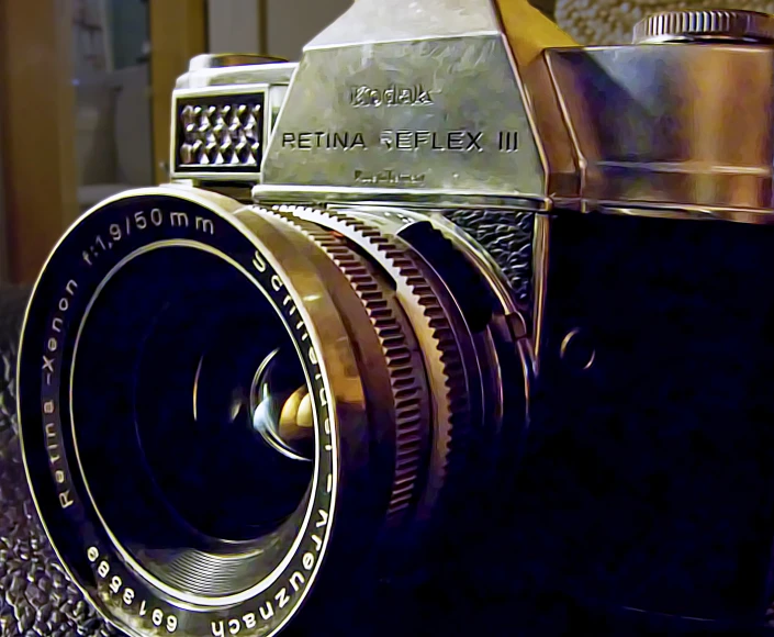 an old fashioned film camera on top of a table