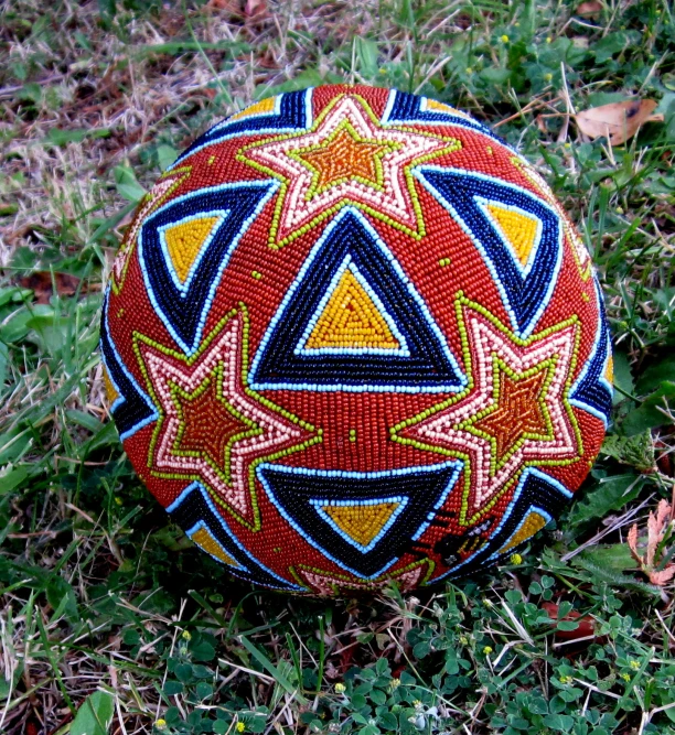 this ball is decorated with colorful patterns and features