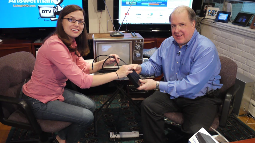 the woman is playing with her friend in a television set