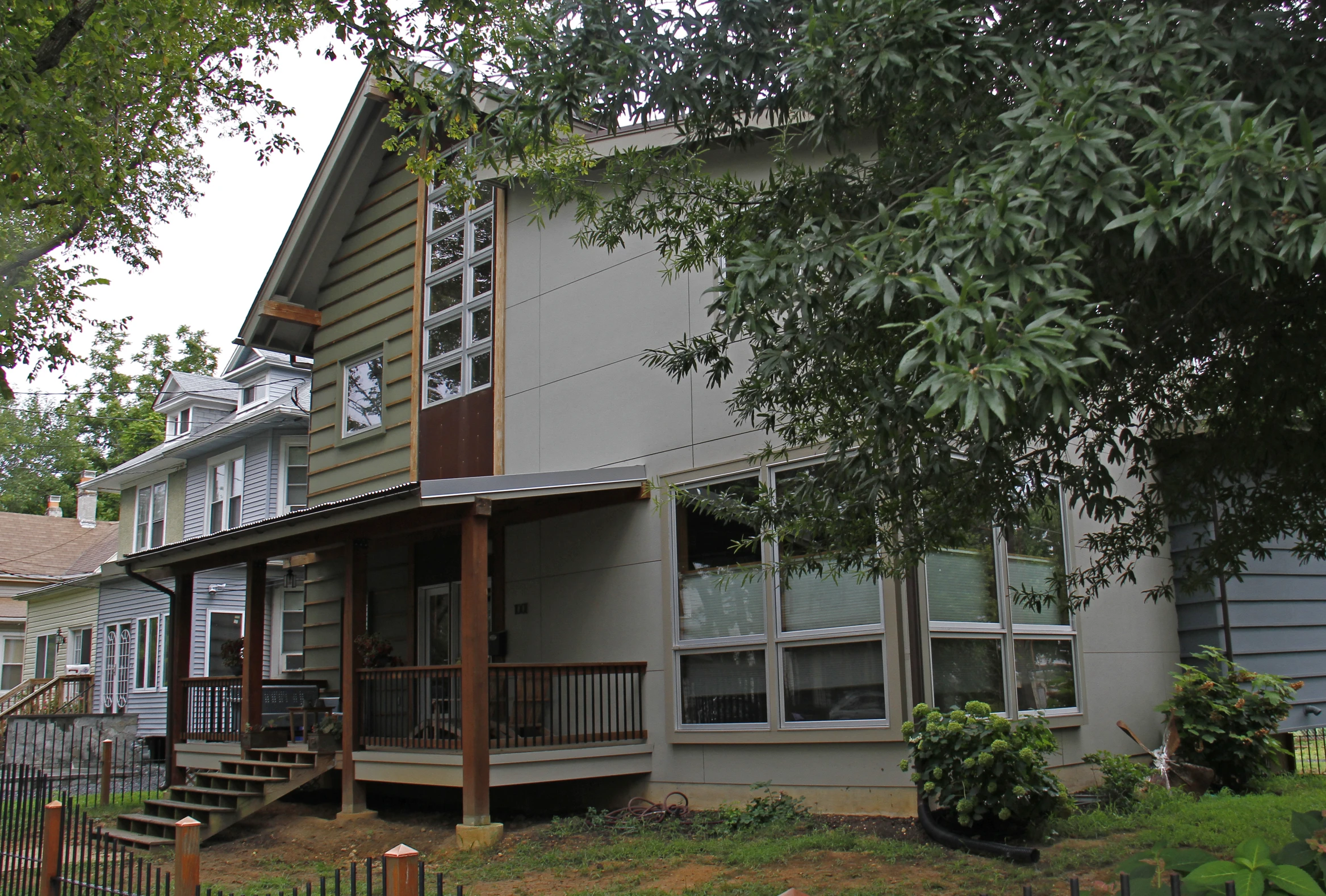 two story house with covered porchs on the front