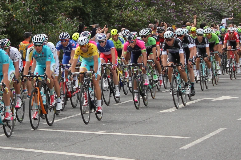 a group of people that are riding on bicycles