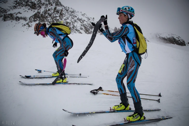 a couple of people that are on some skis