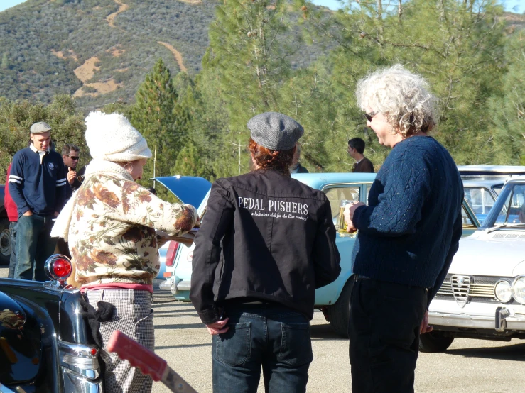 a group of elderly women talking to each other