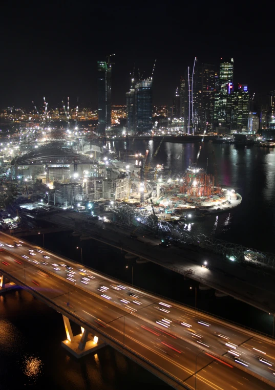 the nighttime view of a city's downtown area from a high - rise