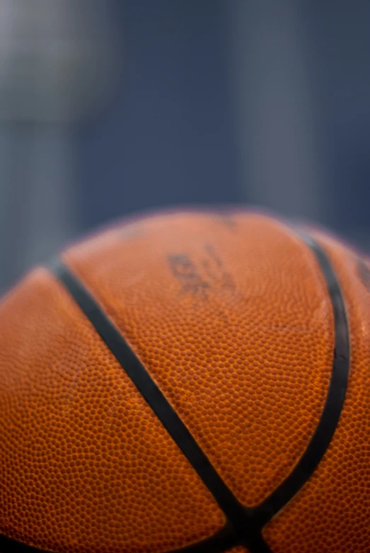 a basketball is shown on top of a glass table