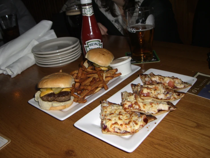 the table has several plates with different food items