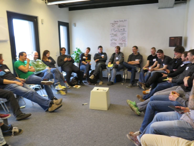 a group of people sitting in a room