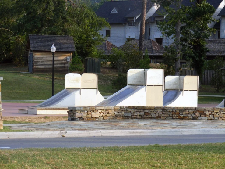three skate park structures in a residential area