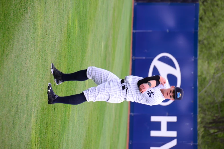 a baseball player standing on top of a field