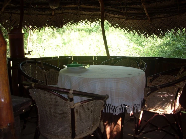 table with an umbrella in the middle of a deck