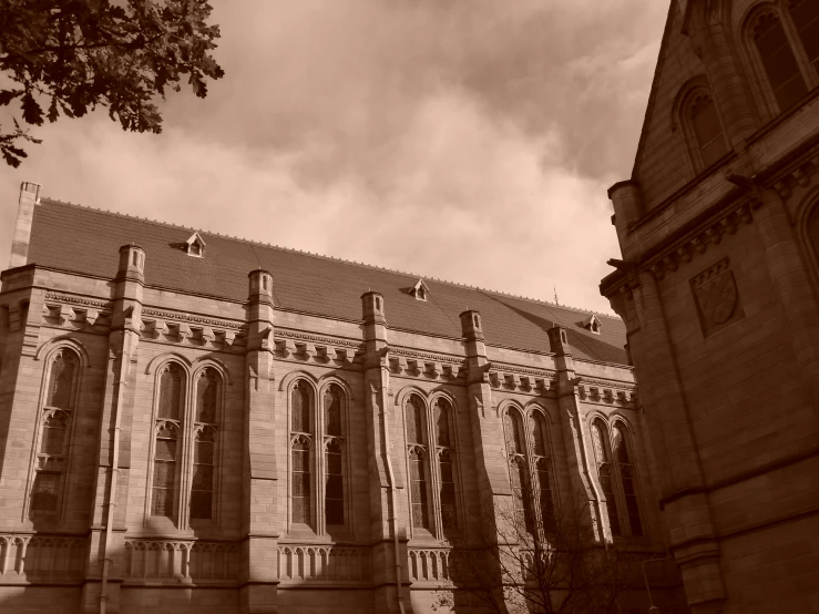 an old stone building is seen against the sky