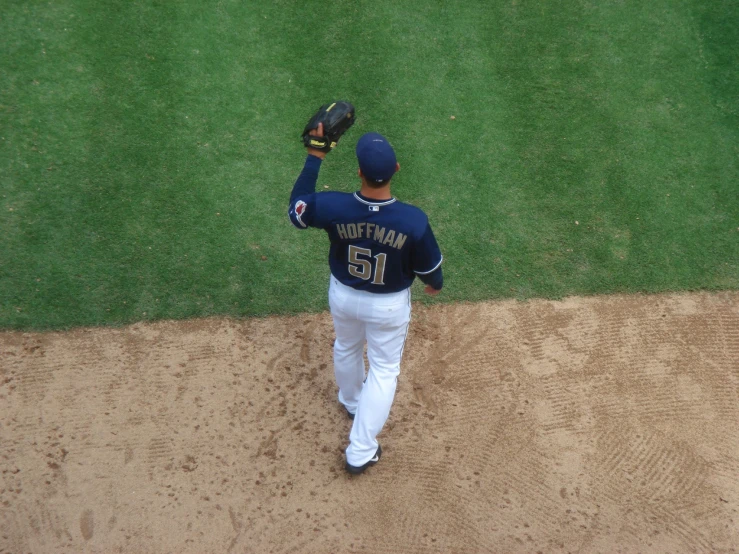 the baseball player is preparing to throw the ball