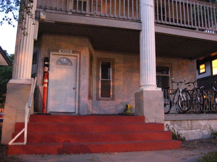 a couple of bikes that are next to a house