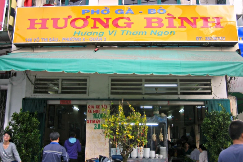 a large asian restaurant sign above the entrance