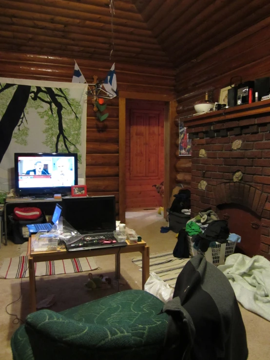 a living room with wood paneling and a couch