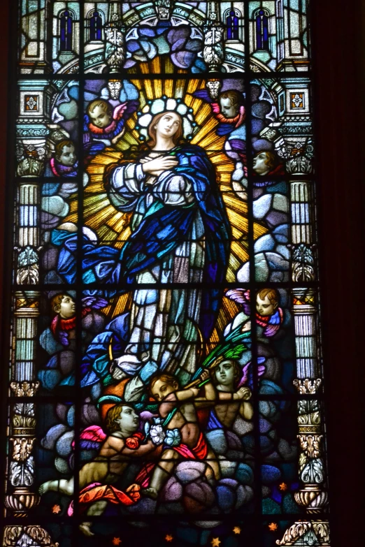 a large stained glass window with many items in it